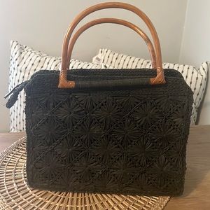 Woven clutch with wood handle